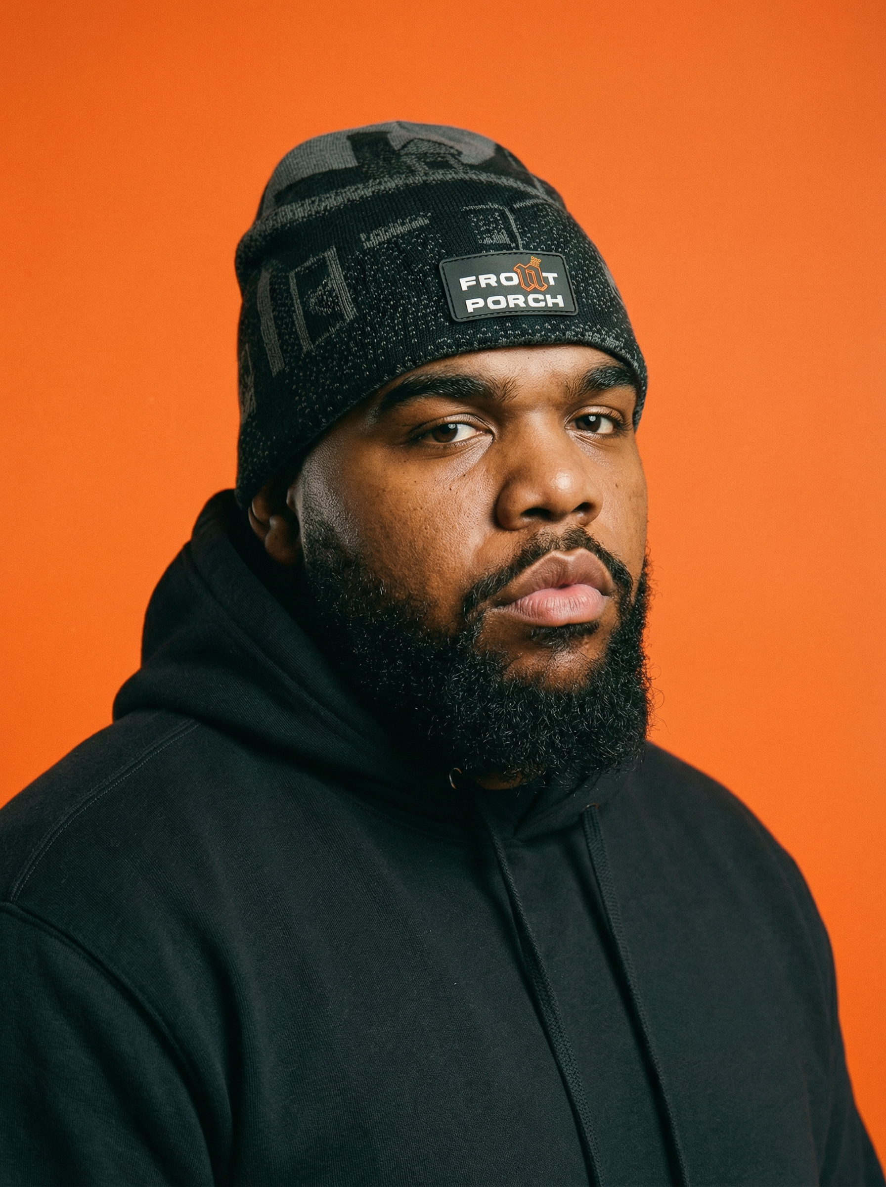 Front Porch Freestyles Live on Set Beanie charcoal black worn male model orange background DMV streetwear