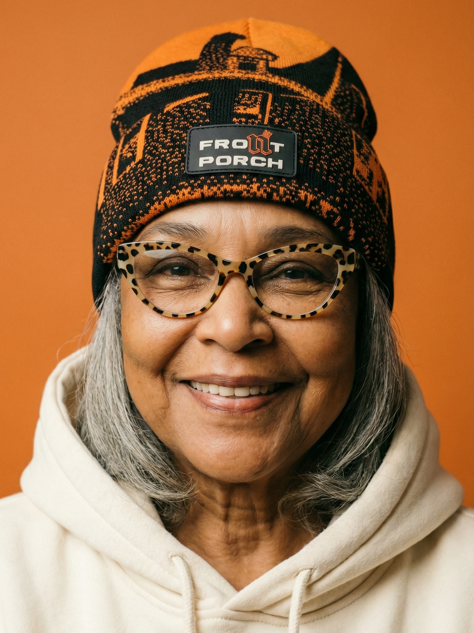 Front Porch Freestyles Live on Set Beanie orange black worn female model orange background DMV streetwear