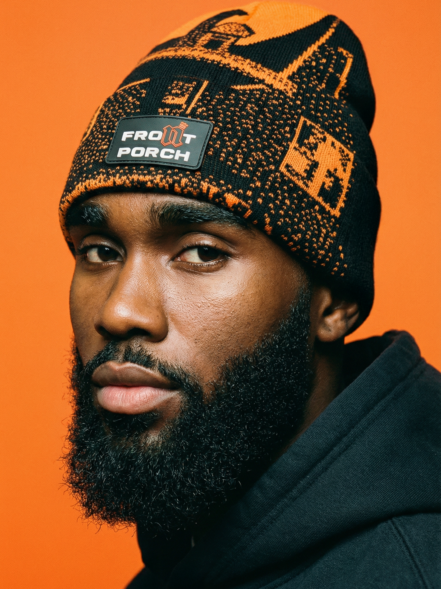 Front Porch Freestyles Live on Set Beanie orange black worn male model orange background DMV streetwear