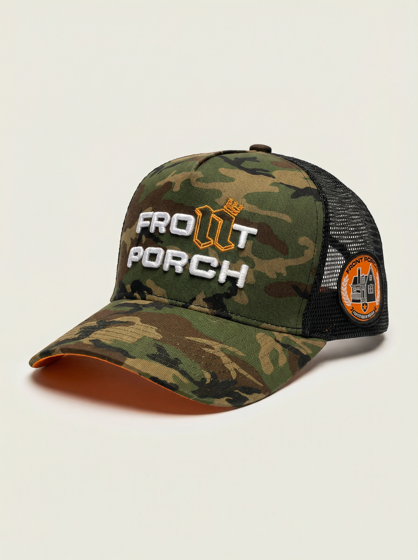 Right side of Front Porch Freestyles camo trucker showing crest patch reading Fortitudo In Musica embroidery on black mesh